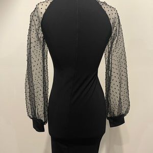 Black cocktail dress w sheer long sleeves. Size medium